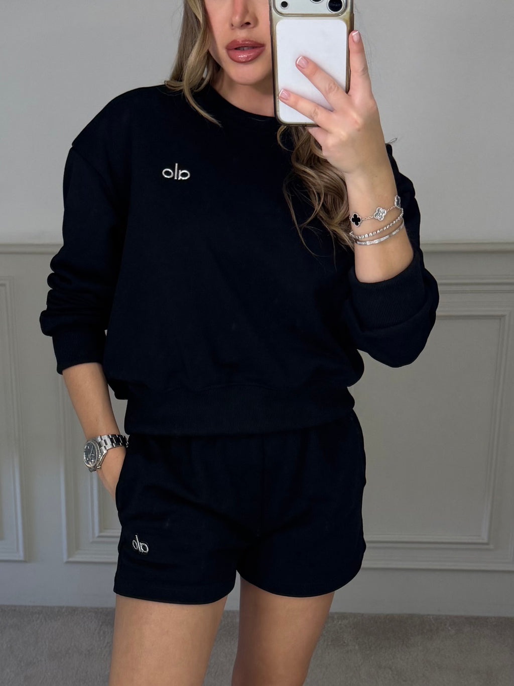 Black jumper and shorts co-ord worn front on