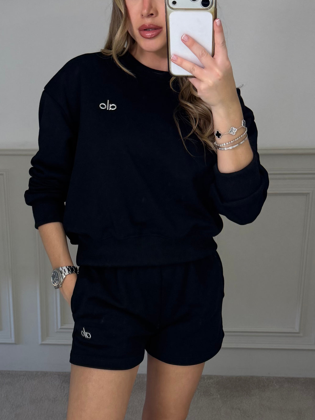 Black jumper and shorts co-ord worn front on