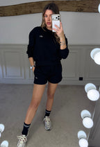 Back view of the black shorts and jumper set