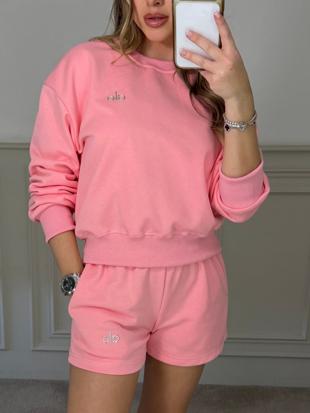 Pink jumper and shorts co-ord worn front on