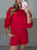 Close detail of the red jumper fabric and trim