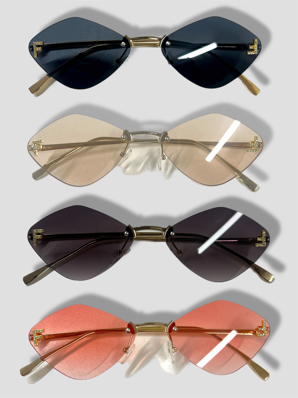 FE frameless diamond sunglasses with gold arm
