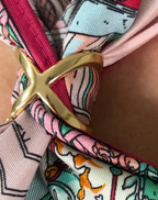X scarf ring worn with a silk scarf