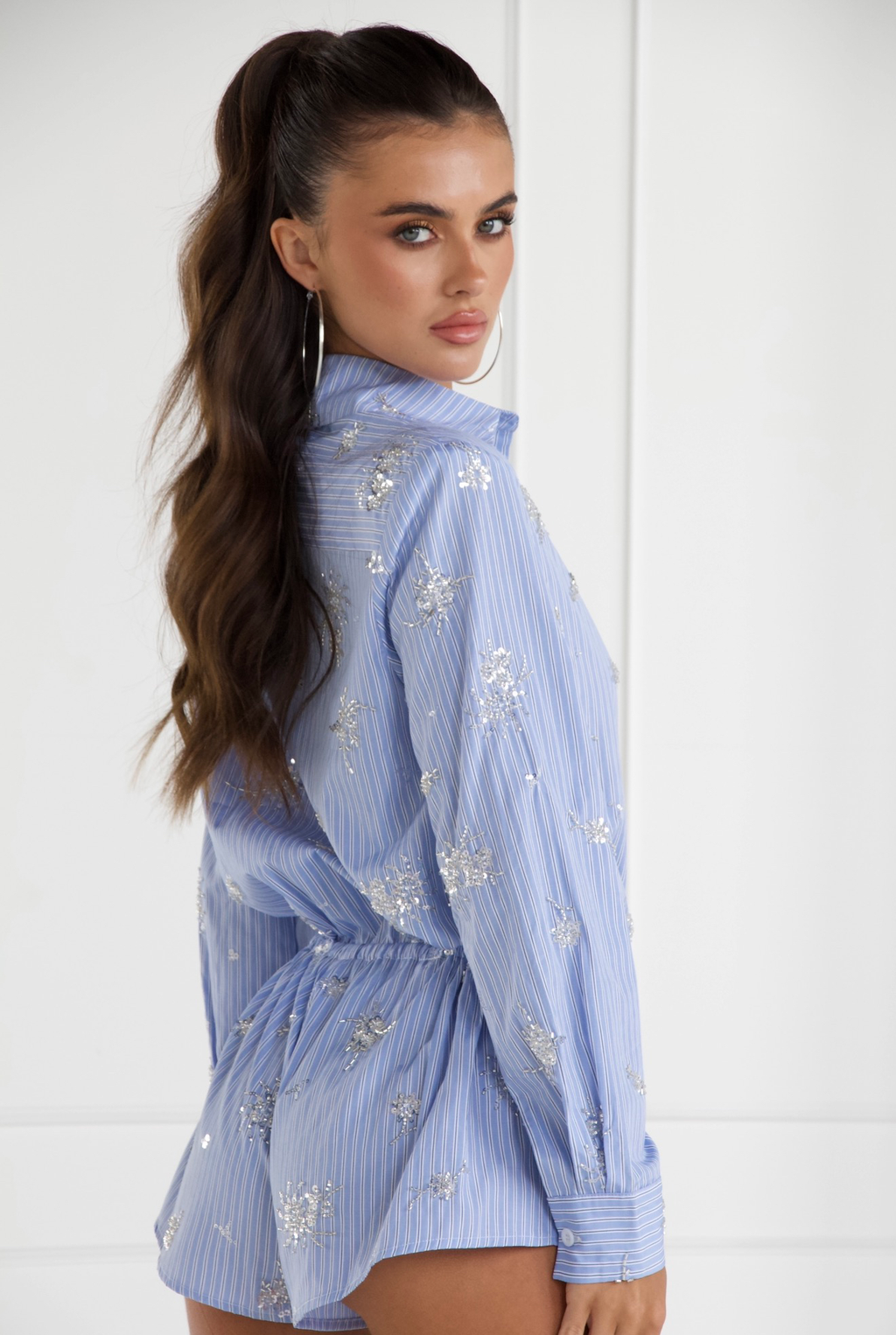 Blue embellished romper, back view