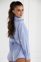 Blue embellished romper, back view