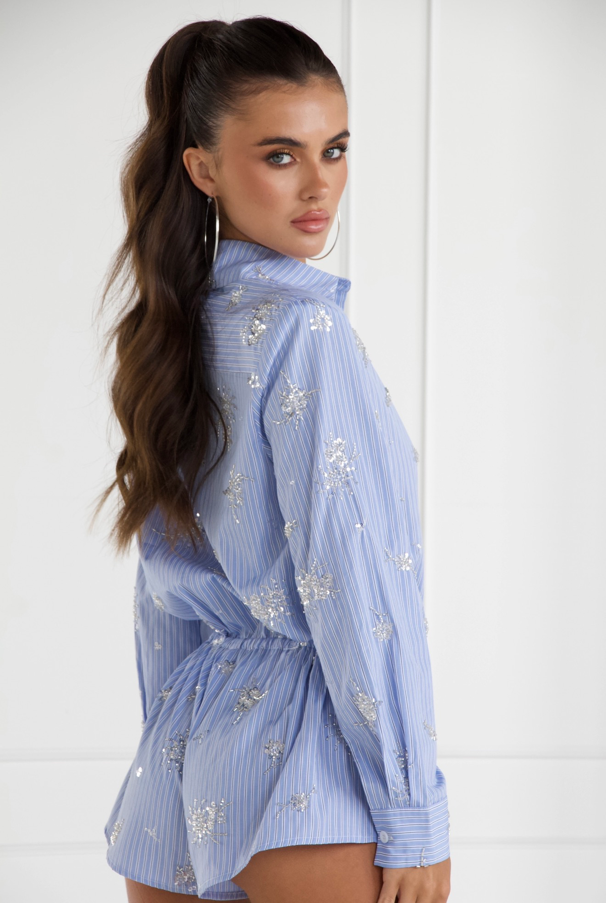 Blue embellished romper, back view
