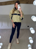 Beige and navy track jacket styled with matching bottoms