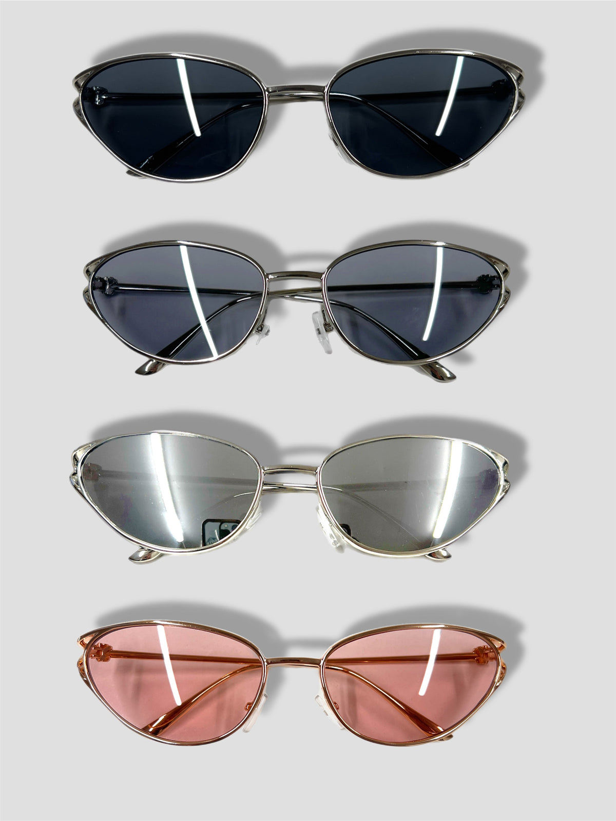 TEGA cat eye knot sunglasses in silver and rose gold