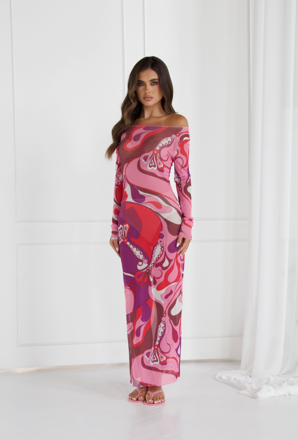 Model wearing the EMILIO Pink Orchid long sleeve mesh dress, front view