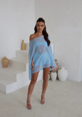 Model wearing the blue cape three piece bandeau and shorts set, front view