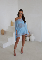 Model wearing the blue cape three piece bandeau and shorts set, front view