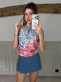 Model wearing the steel blue zip up skort