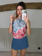 Model wearing the steel blue zip up skort