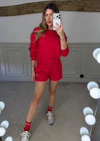 Back view of the red shorts and jumper set