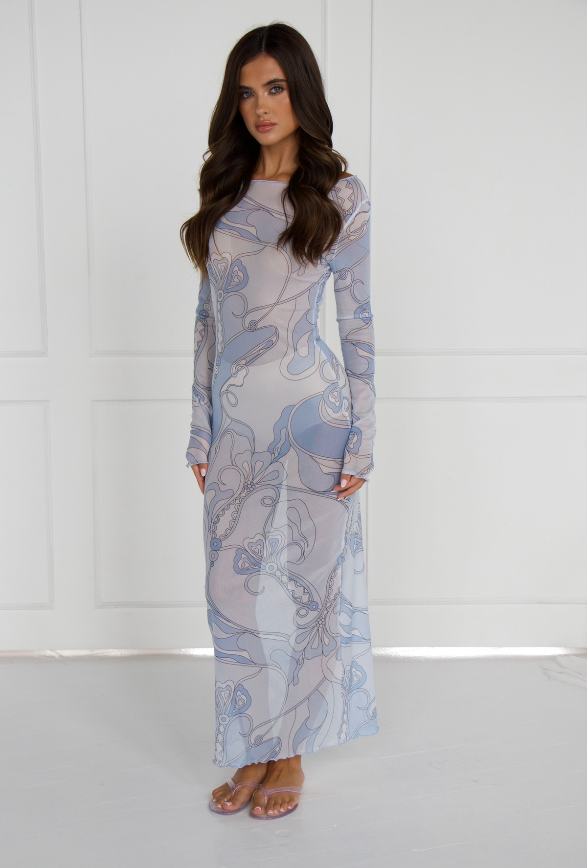 Model wearing the EMILIO Orchid blue long sleeve mesh dress, front view
